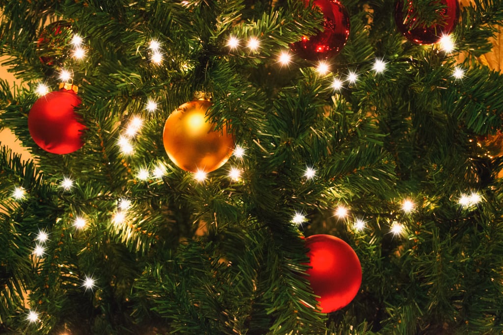 15. Stock Up the Day After Christmas
Did a string of tree lights burn out this year? Don't wait until next season to replace them — we guarantee you'll be halfway through trimming your Fraser Fir before you realize you need to make an emergency run to get new ones. Most stores have great day-after-Christmas sales, so it's the best time to grab other essentials like holiday wrapping paper and a new stocking if, say, a baby is on the way.
16. Store Smarter
You can organize boxes by room (one for the foyer, one for the living room) or by type of object (all wreaths together), but we wholeheartedly recommend clear bins so that you can easily see what's inside. Also, there's no such thing as having too many labels, especially with your box of ornaments. If you have specific ornaments that need to go in specific containers, write it on there. Trust us, you think you'll remember where they all go, but you won't.