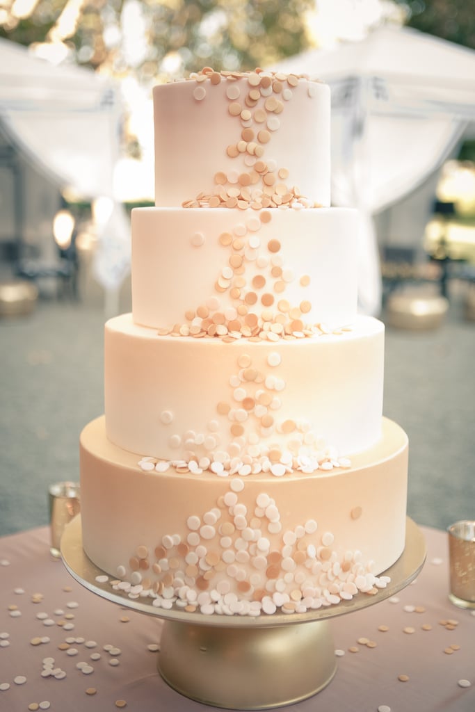 Count this as the most elegant confetti we've ever seen. The fun details on this four-layered, blush-colored wedding cake are pretty exceptional.