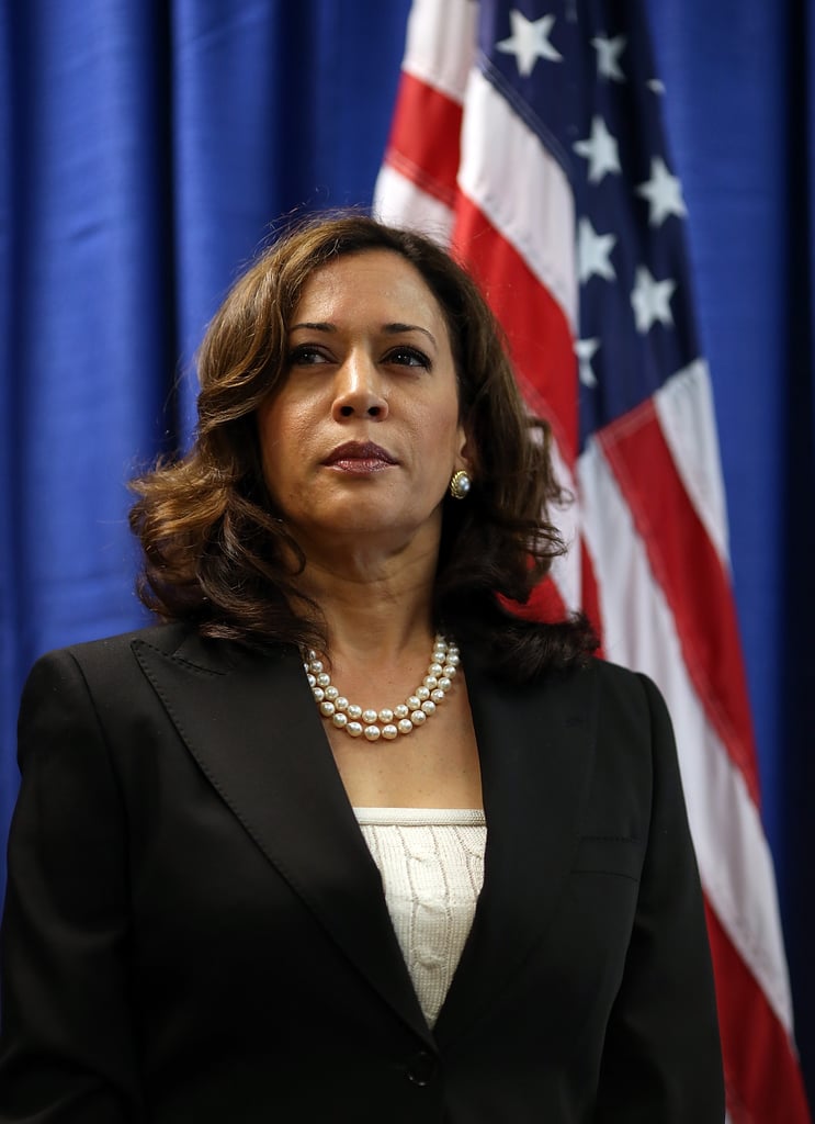 In July 2012, Kamala performed her duty as California Attorney General in an ivory cable knit tube top and sophisticated black blazer with her double strand of pearls.