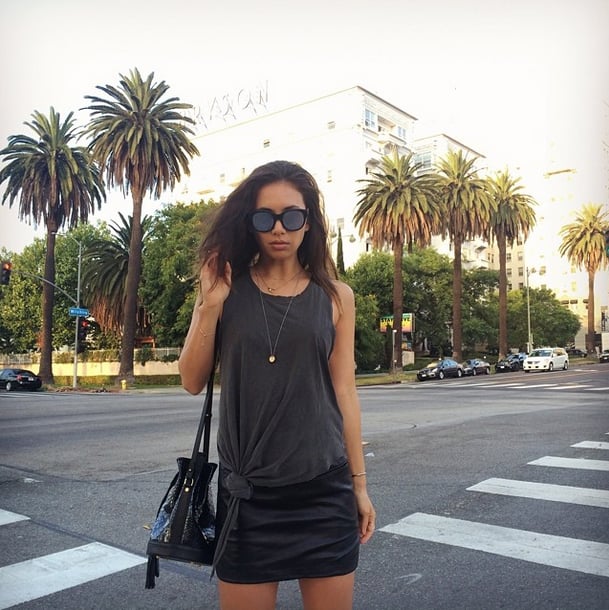 In the Summer, tying a knot in a baggy tee is a go-to style trick. Up the fancy factor with layered jewelry and a statement satchel.
Source: Instagram user rumineely