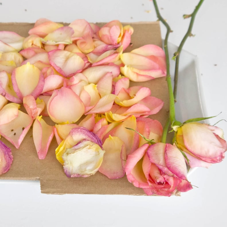 Using dry rose petals to make rose potpourri which is great for home scent.  Mason jar filled with dry rose petals and puds with meditating Buddha Stock  Photo - Alamy