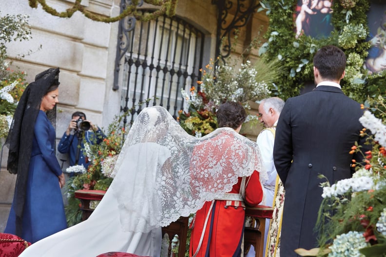 She Also Wore a Lace Veil During the Ceremony