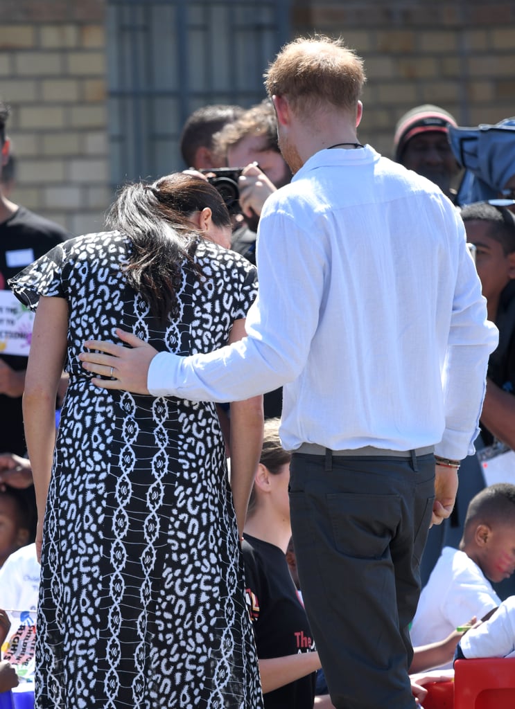 Meghan Markle and Prince Harry Hands on Each Other's Backs