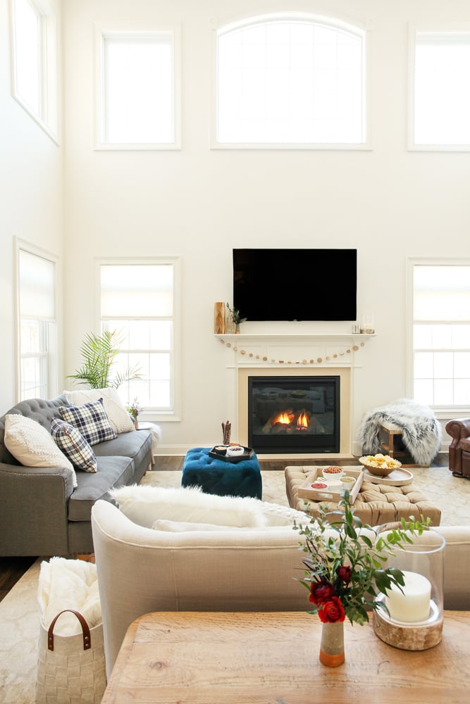 Mixing up the patterns and textures of pillows and throws, as Jessie has done with her plaid, cable-knit, and faux fur accessories, adds dimension and warmth to the home.