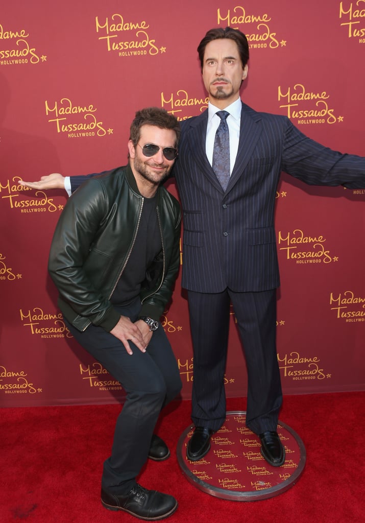 Bradley Cooper had fun with Robert Downey Jr.'s wax figure in LA on Monday.