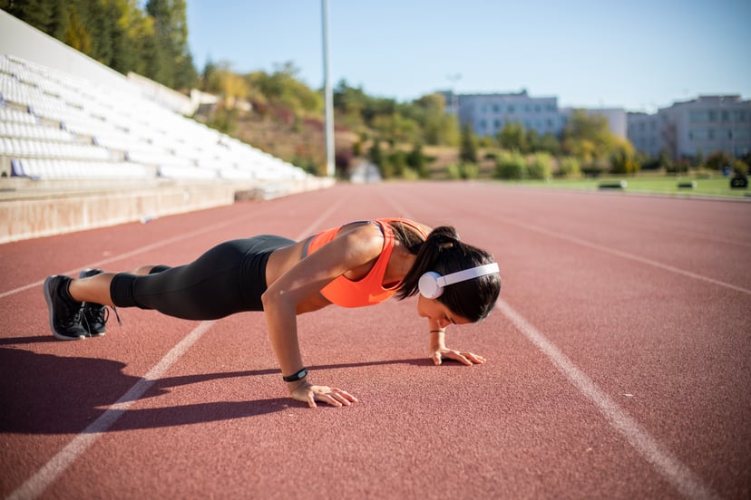 Athletic woman exercising push-ups