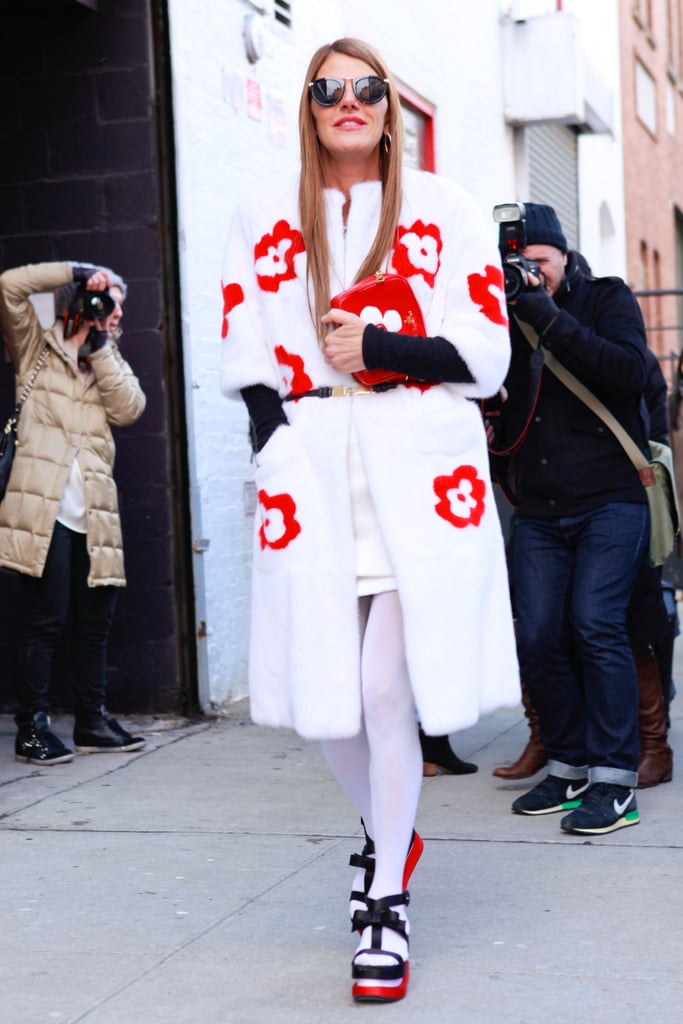 Per usual, Anna Dello Russo drew the eye in a floral-dotted statement coat and black and red platforms.
Per usual, Anna Dello Russo drew the eye in a floral-dotted statement coat and black and red platforms.