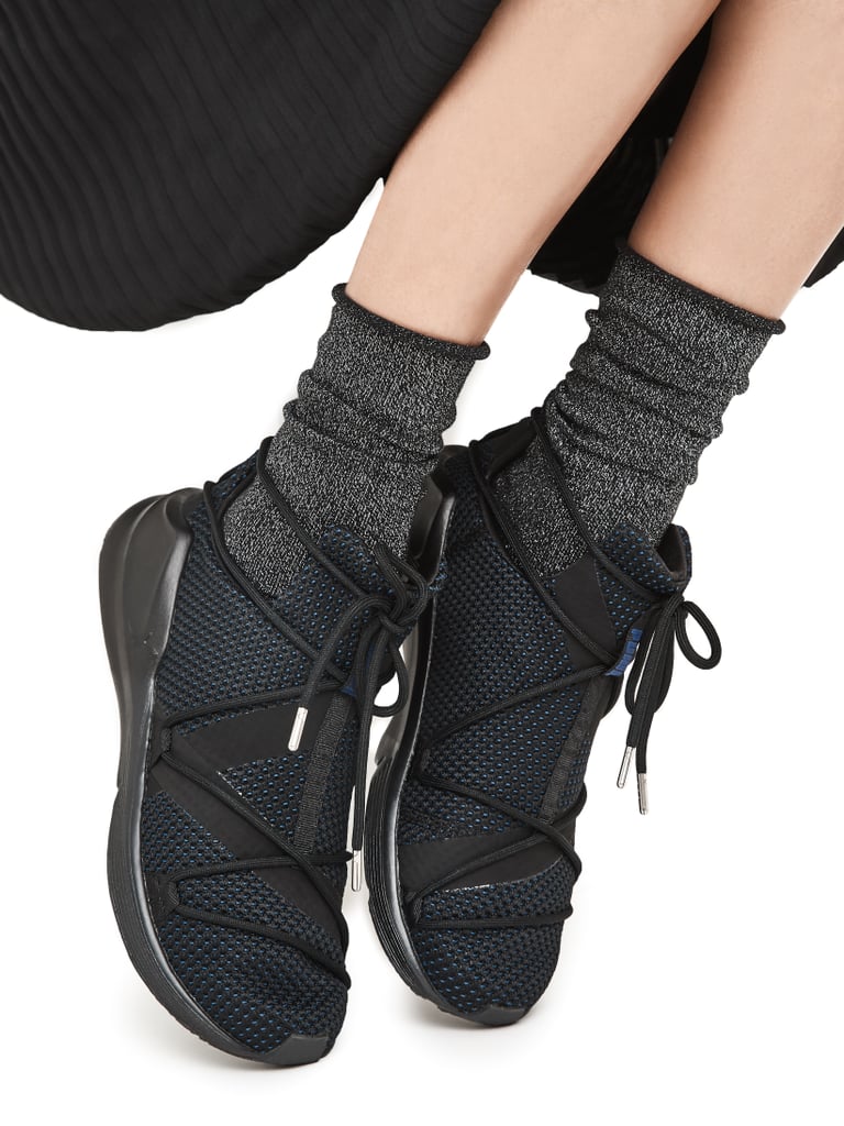 Continue the cool factor by opting for slouchy socks tucked into mesh sneakers rather than reaching for the typical heels or boots.