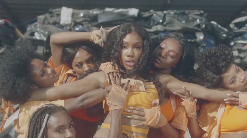 SZA Wearing an Orange Outfit in the "Hit Different" Video