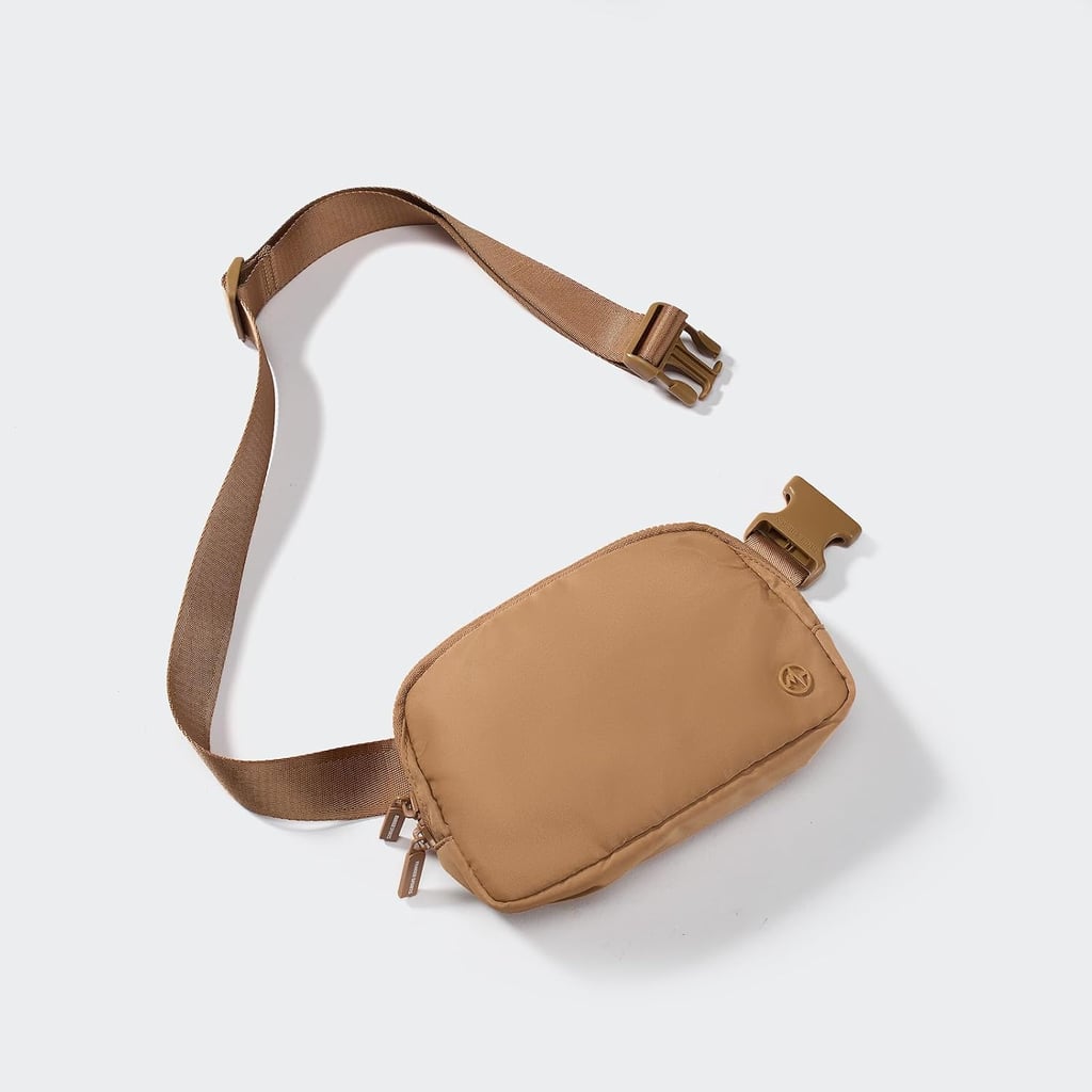 Pander Two Way Zipper Fanny Pack ($12, originally $15)
If you're looking for a compact fanny pack you can wear for activities like cycling or hiking, this one is a fantastic option. It's made of water-resistant nylon fabric, has an adjustable strap, and is equipped with two-way zippers. It comes in 19 colors, including this pretty caramel brown.