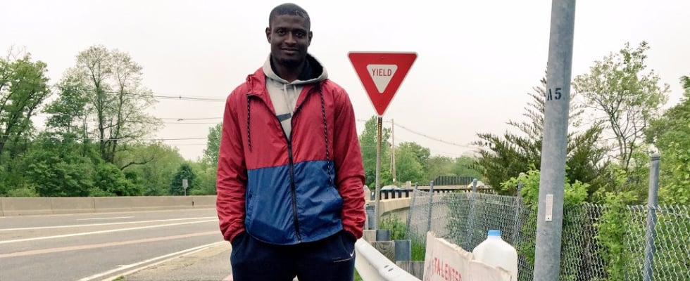 Football Player Waits Outside Patriots Stadium For Tryout