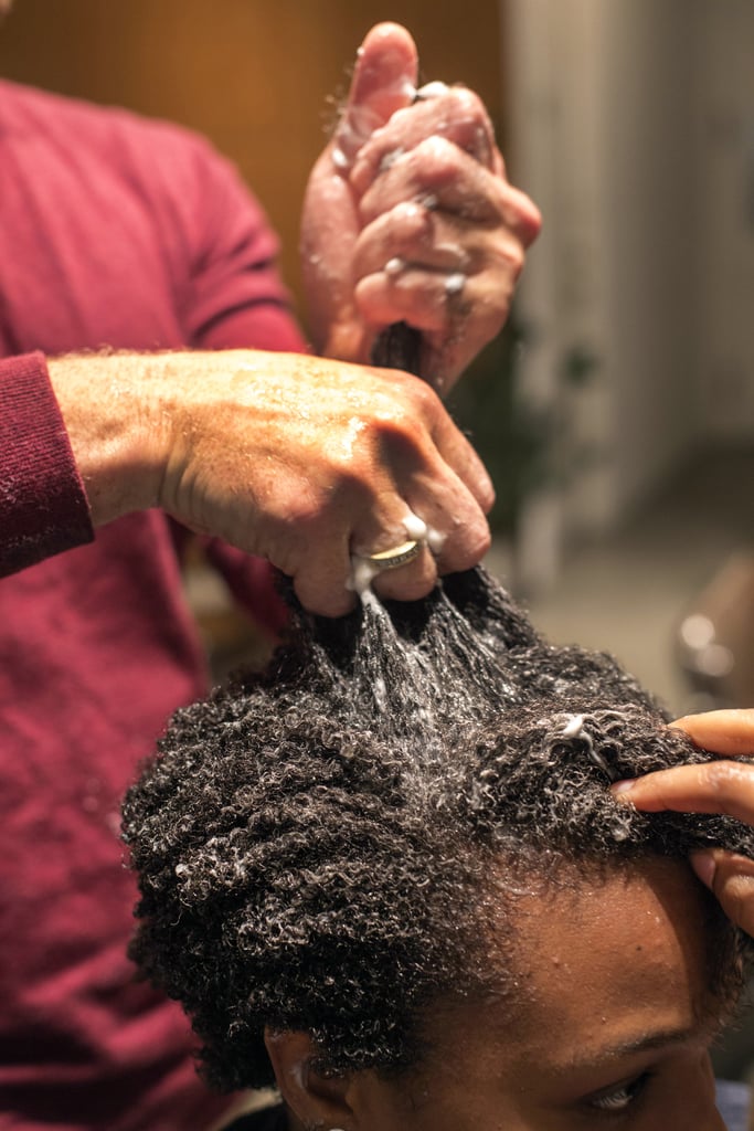 Kinky hair types often experience extreme shrinkage, but it turns out the process to long ringlets begins in the shower. "When women say they don't get salon results at home, we find out they're using quarter-sized amounts of product," Dickey said. For natural textures, he recommended using an amount more along the lines of golf and tennis ball proportions. 
When it comes to applying conditioner, completely coat your strands with it. Use your fingers to detangle, pulling hair from roots to ends; this will help lengthen and clump curls together. You can also use this same technique when you put in a styling gel, such as the brand's Kinky Curling Cream ($26).