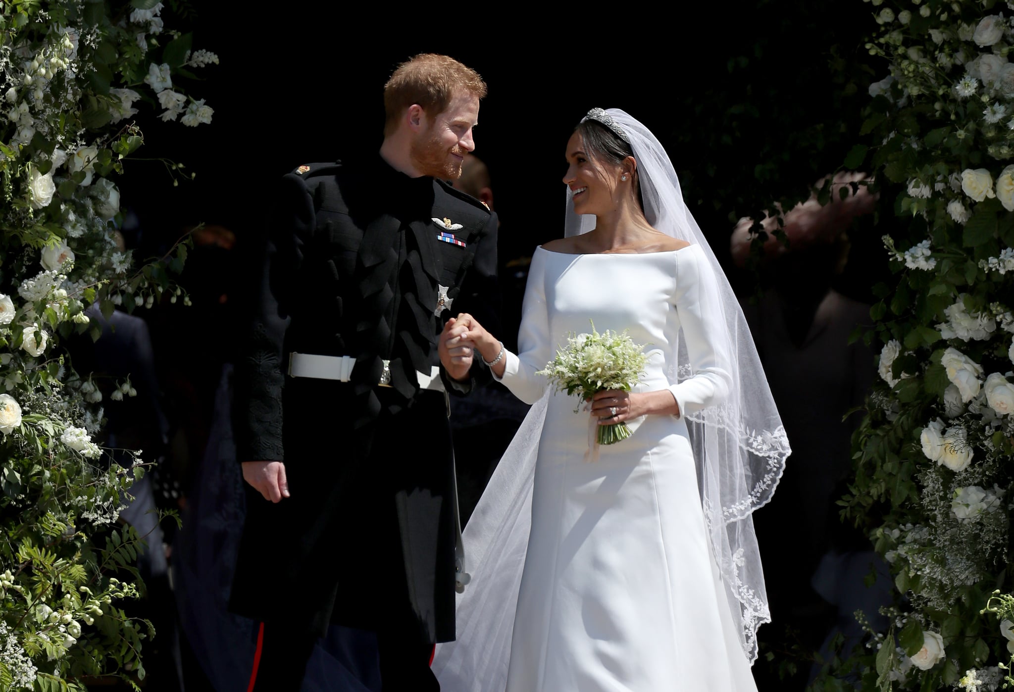 WINDSOR, UNITED KINGDOM - MAY 19:  Prince Harry, Duke of Sussex and The Duchess of Sussex share a kiss after their wedding at St George's Chapel at Windsor Castle on May 19, 2018 in Windsor, England. (Photo by Jane Barlow - WPA Pool/Getty Images)