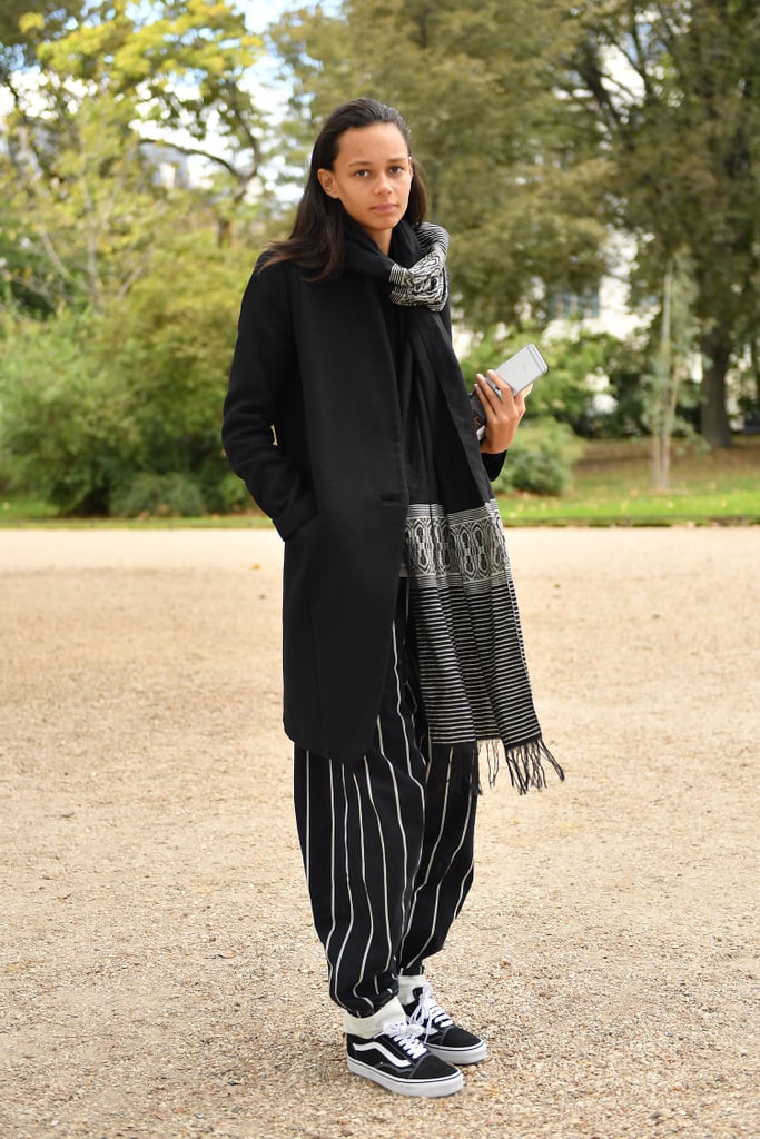 Binx Walton Left the Alexander McQueen Show in Striped Trousers, a Black Coat, and an Oversize Scarf