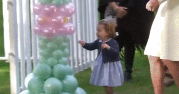 Charlotte Beating the Crap Out of a Balloon Arch
