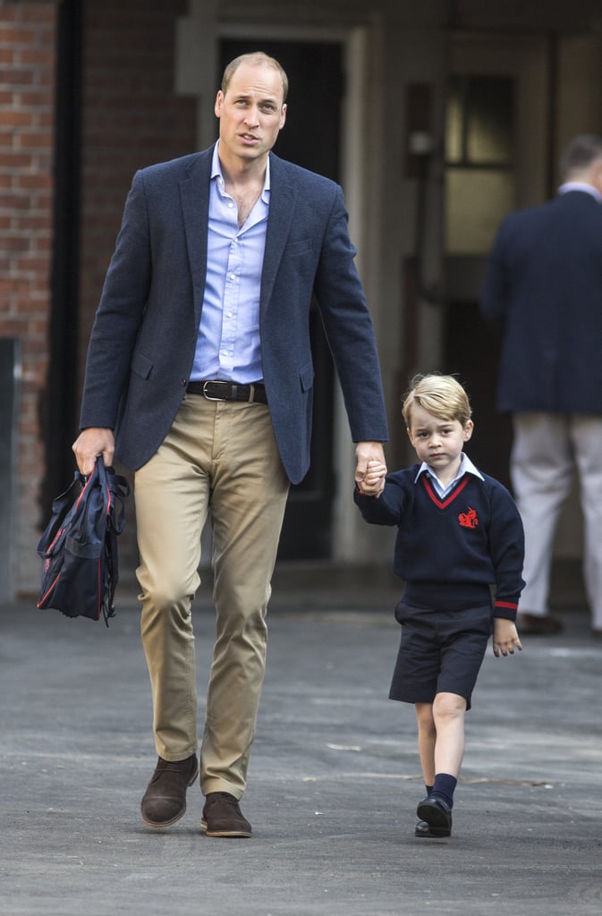 He held onto George's hand as he attended his first day of school.