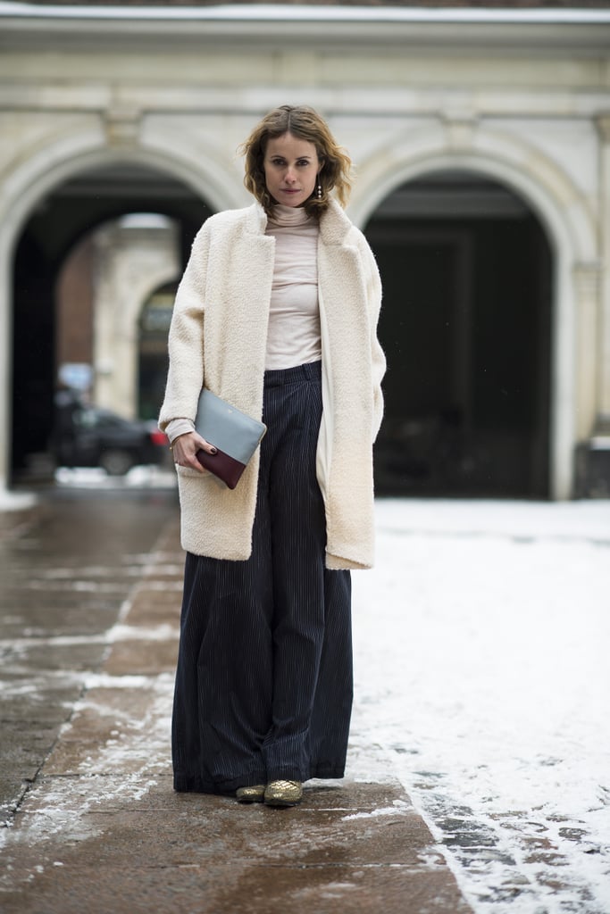Wide-leg trousers further the vintage flair of a fuzzy coat.
Source: Le 21ème | Adam Katz Sinding