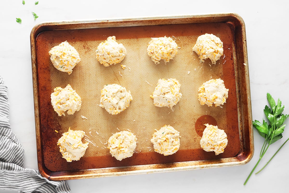 Scoop biscuits onto baking sheet