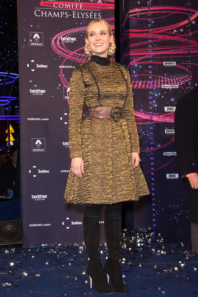 Kruger wore a brocade, metallic coatdress and leather tiger belt, both by Lanvin, with over-the-knee boots for a November 2012 event in Paris.