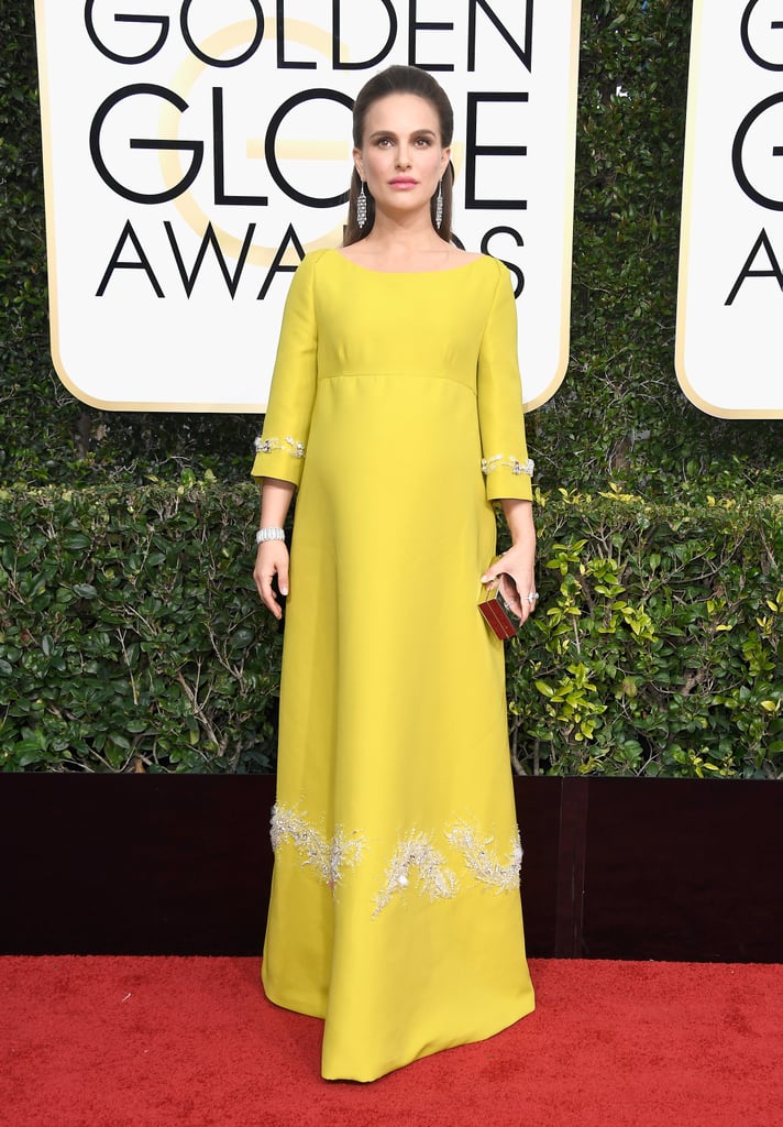 Natalie Portman paid homage to Jackie Kennedy's Oleg Cassini inauguration gown in an embellished Prada dress, Jimmy Choo shoes, and Tiffany & Co. jewels (her bracelet is from 1910!) in 2017.