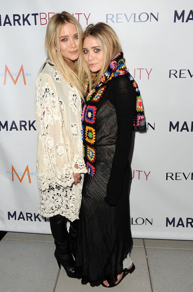 Twinning combo: A little crochet never hurt anyone. The girls celebrated the launch of MARKTBeauty.com in lots of boho-chic layers.

Mary-Kate softened her black leather look with a cream-colored crochet wrap.
Ashley wrapped a multicolored crocheted scarf over her white-and-black look.