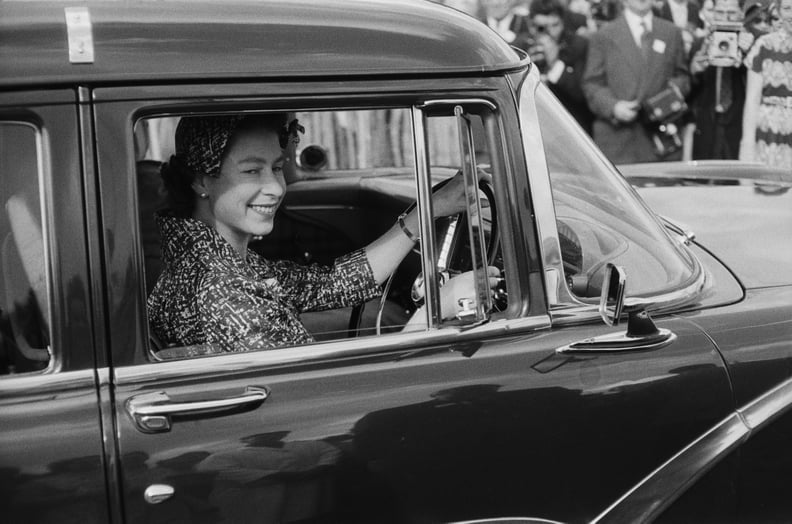 Queen Elizabeth II drives to a polo match in 1958.