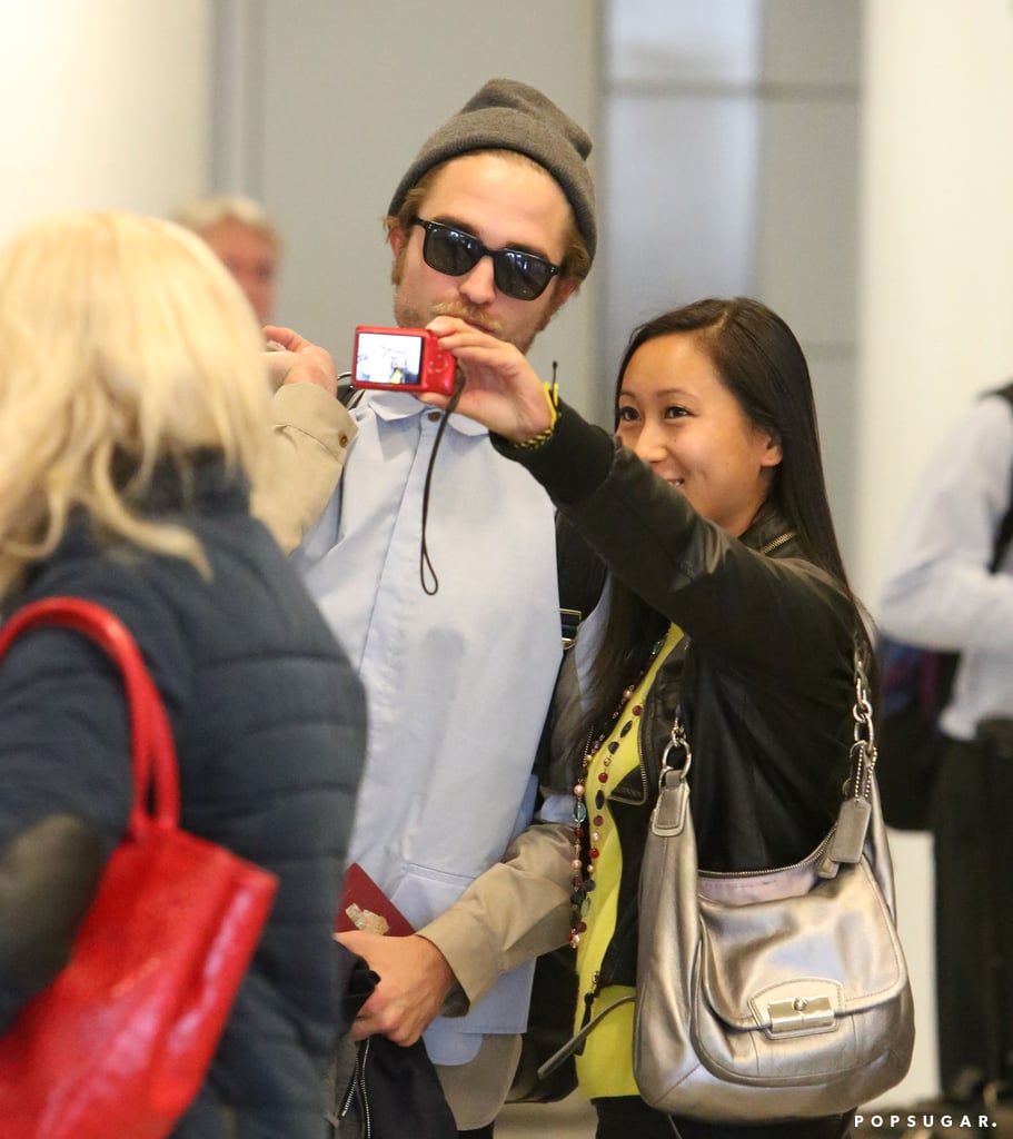 Robert Pattinson took a selfie with a fan after arriving in Toronto on Sunday.