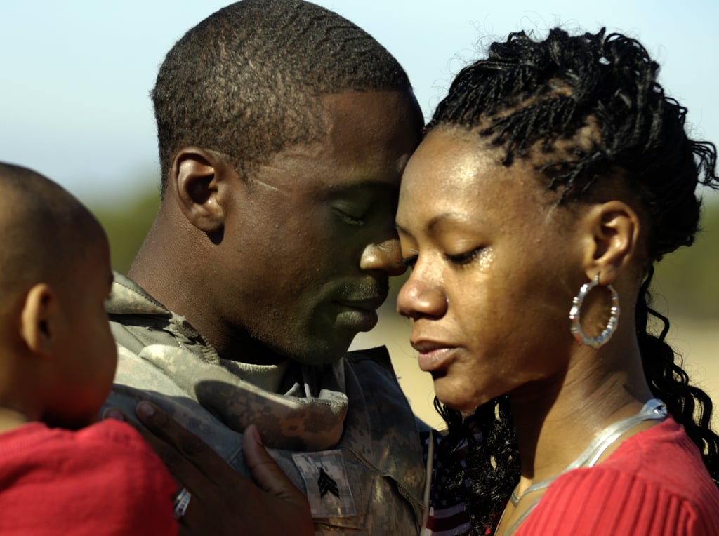 US Army Sgt. Jatorrio Brooks holds his wife, Stephanie, and son, TyReeq, during a homecoming ceremony in 2008.