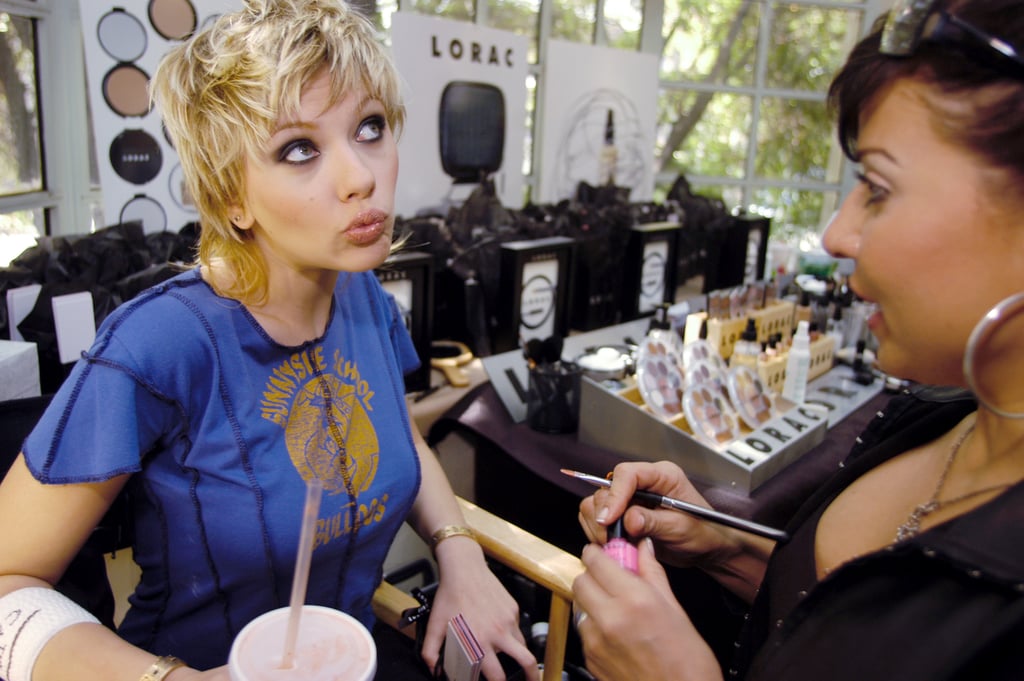 Scarlett struck a silly pose while getting her nails done at an event in 2003.