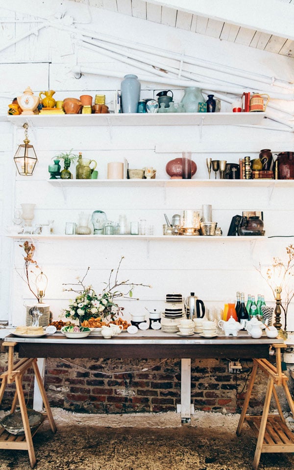 Ampersand, a garage in San Francisco's Mission district, was converted into a romantic flower shop and event venue. By adding teal barn doors, string lights, and ample shelving, its owners created a seriously inspiring garage space!