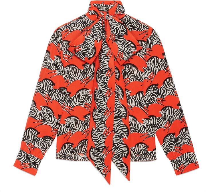 The voluminous pussy-bow on Gucci's zebra-print neck bow shirt ($4,355) makes the look even louder.