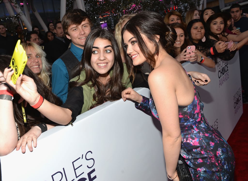 Lucy Hale leaned in for a picture with a fan.