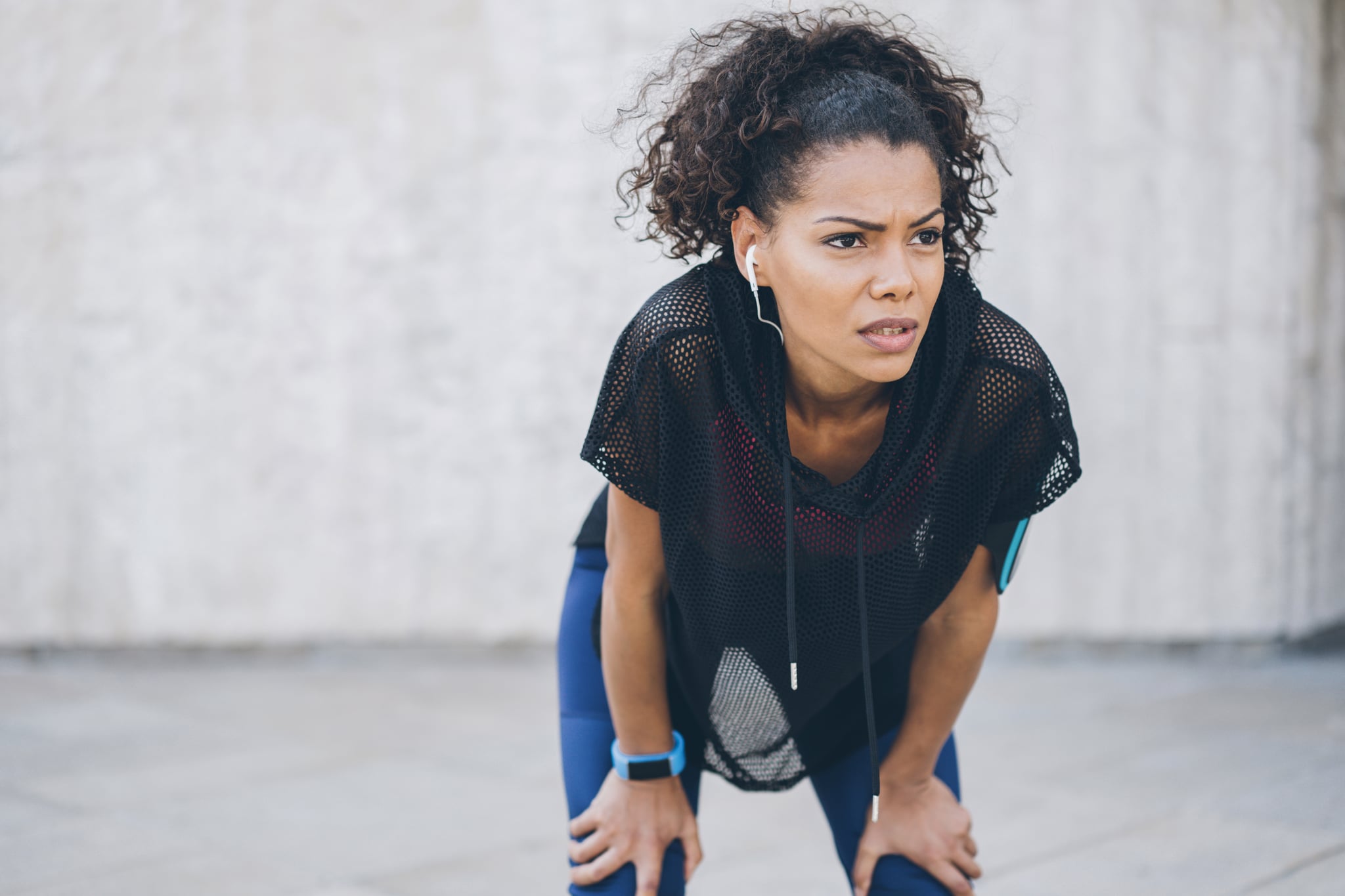 Young african-american woman resting after work out outdoors