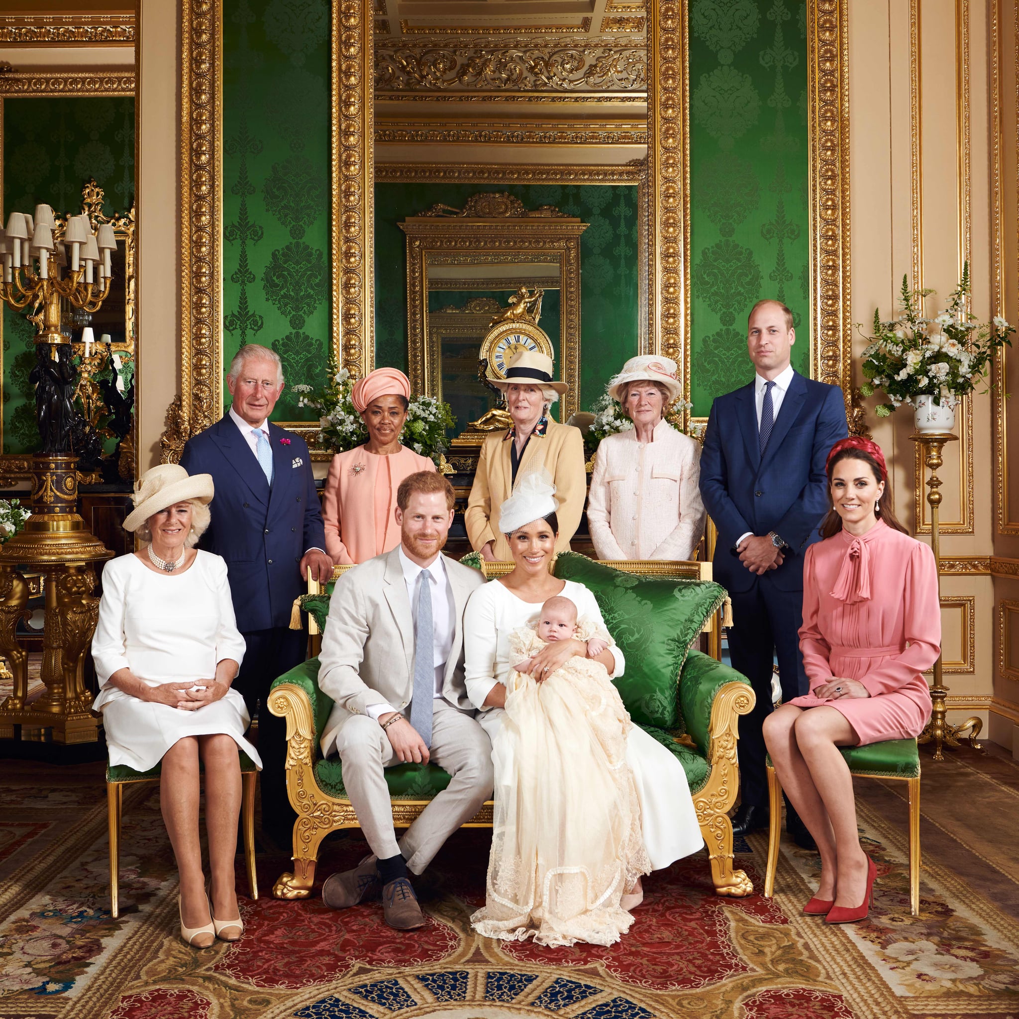 This official handout Christening photograph released by the Duke and Duchess of Sussex shows Britain's Prince Harry, Duke of Sussex (centre left), and his wife Meghan, Duchess of Sussex holding their baby son, Archie Harrison Mountbatten-Windsor flanked by (L-R) Britain's Camilla, Duchess of Cornwall, Britain's Prince Charles, Prince of Wales, Ms Doria Ragland, Lady Jane Fellowes, Lady Sarah McCorquodale, Britain's Prince William, Duke of Cambridge, and Britain's Catherine, Duchess of Cambridge in the Green Drawing Room at Windsor Castle, west of London on July 6, 2019. - Prince Harry and his wife Meghan had their baby son Archie christened on Saturday at a private ceremony. (Photo by Chris ALLERTON / SUSSEXROYAL / AFP) / XGTY / RESTRICTED TO EDITORIAL USE - MANDATORY CREDIT 