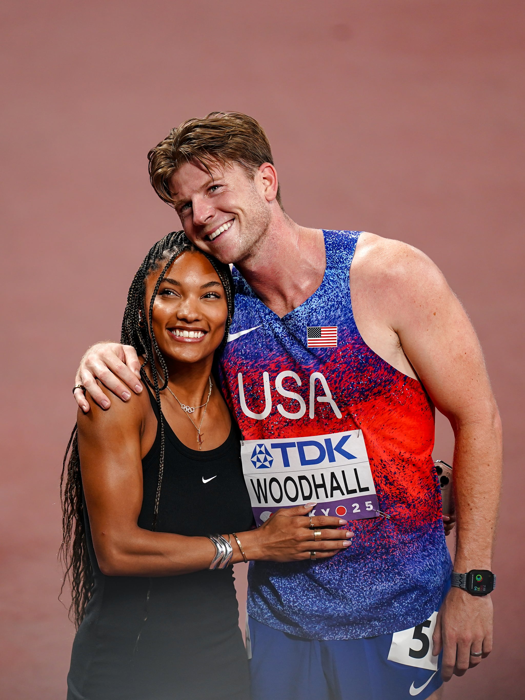 TOKYO, JAPAN - SEPTEMBER 16: Long jumper Tara Davis-Woodhall  of the United States (L) with husband and Paralympic athlete Hunter Woodhall of the United States at day four of the World Athletics Championships Tokyo 2025 at National Stadium on September 16, 2025 in Tokyo, Japan. (Photo by Daniela Porcelli/Getty Images)