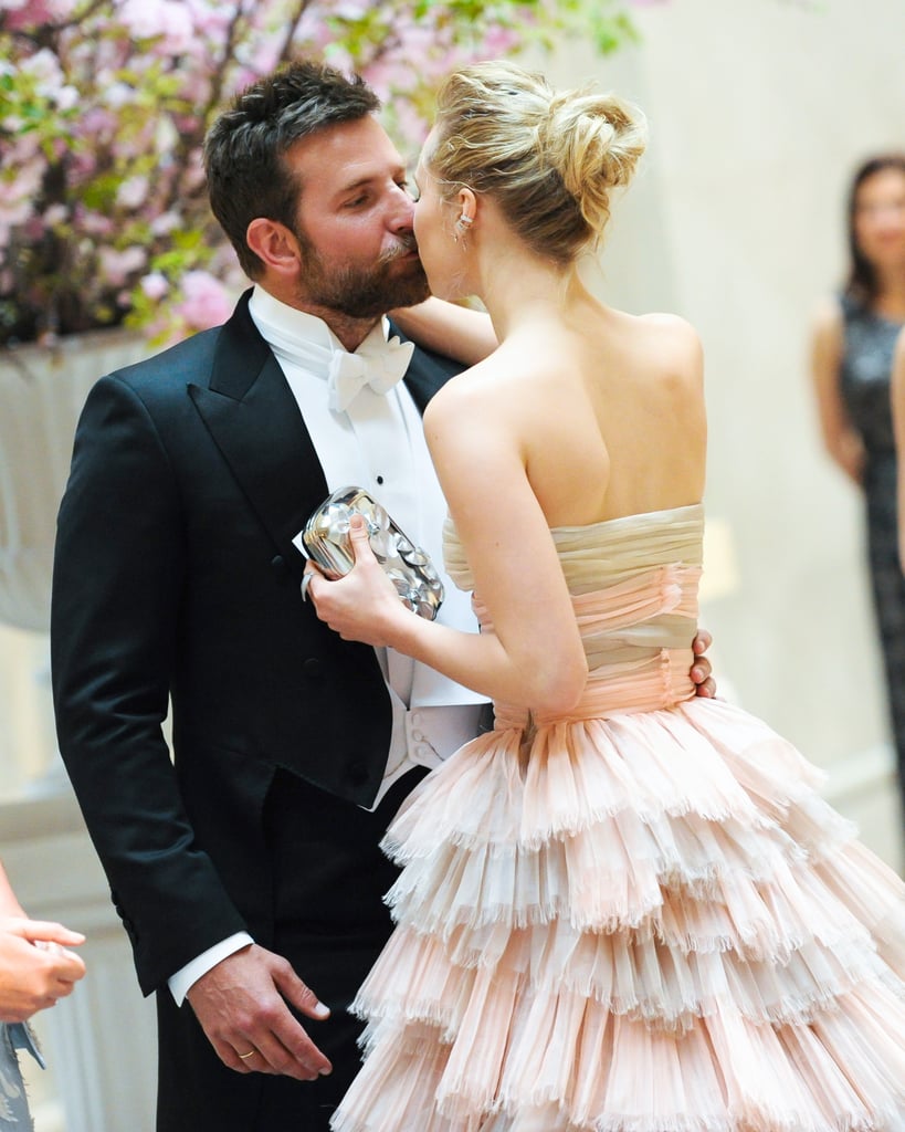 Bradley Cooper and Suki Waterhouse, who called it quits in March, stopped for a kiss on their way into the party. The pair recently sparked reconciliation rumors after they were spotted getting cozy at Coachella in April.