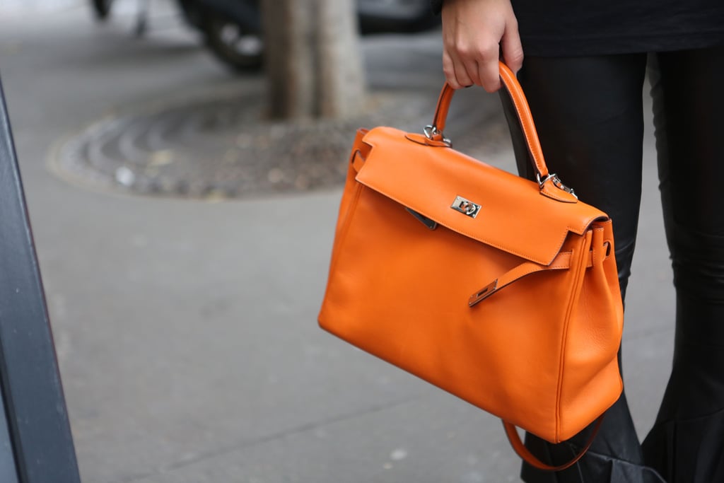 A classic satchel got a makeover in a shot of electric orange.
A classic satchel got a makeover in a shot of electric orange.