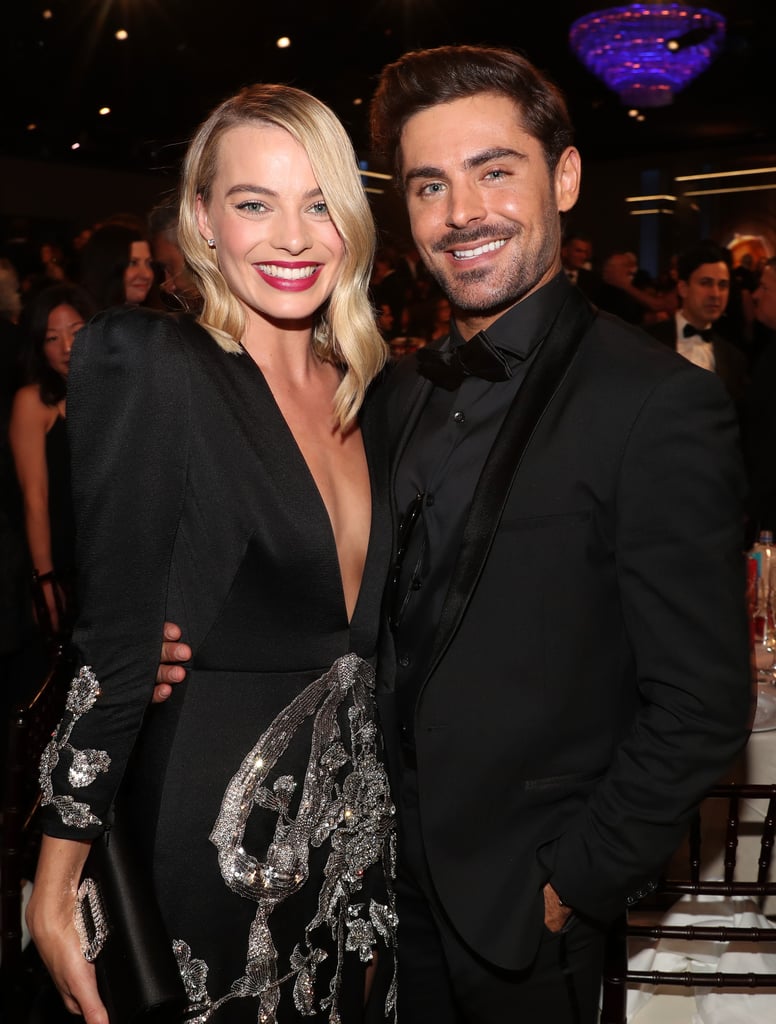 Pictured: Margot Robbie and Zac Efron