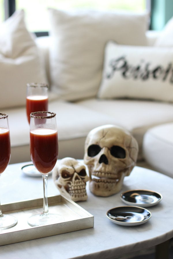 These blood-red cocktails placed near a simple skull help create an elegant atmosphere for a Halloween party. With a few vampire fangs placed around the house, this party definitely will not suck. 

    Related:

            
            
                                    
                            

            9 Spooky Halloween Cocktails Featuring the Most Frightening Spirit: Tequila