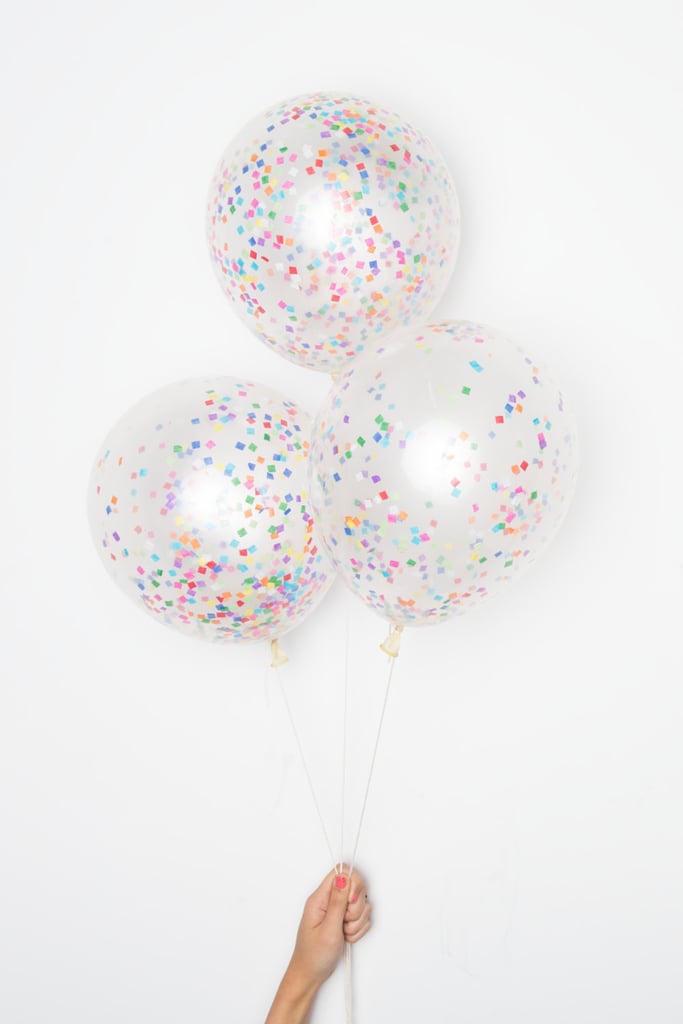 Incorporate bright '90s-inspired colors through confetti balloons ($12 for set of 12).