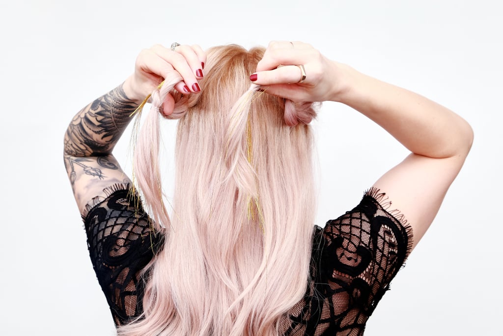 Gently separating one of the twists with your fingers, cross one braid through the other at the crown.