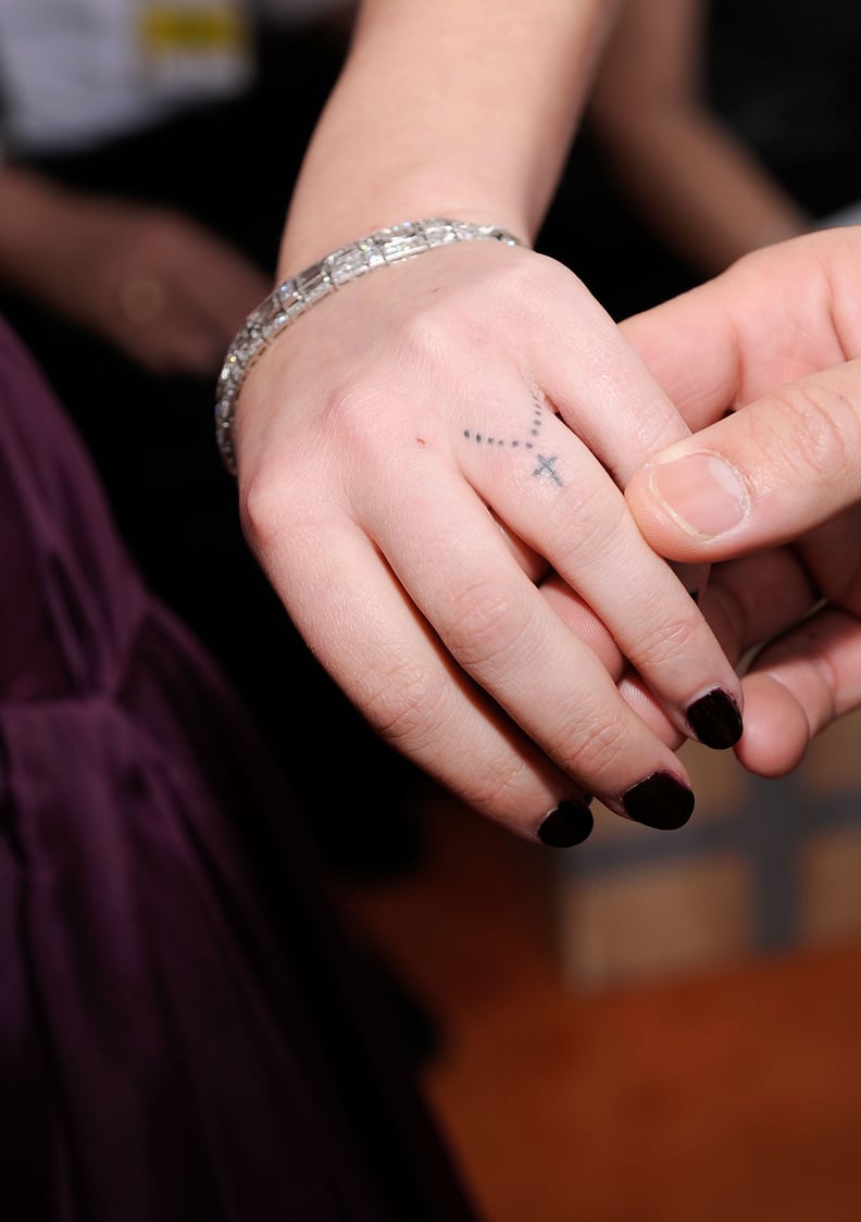 Rumer Willis's Cross Finger Tattoo