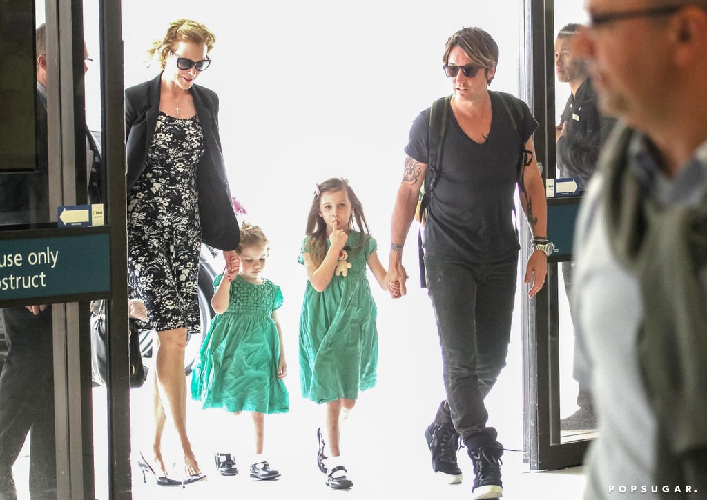 Keith and Nicole held hands with Sunday and Faith.