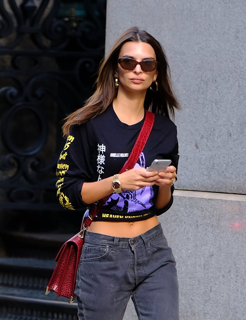 Graphic tees, boyfriend jeans, and midsize hoops are a classic combination, perfect for Emily Ratajkowski's shopping trip — or your own.