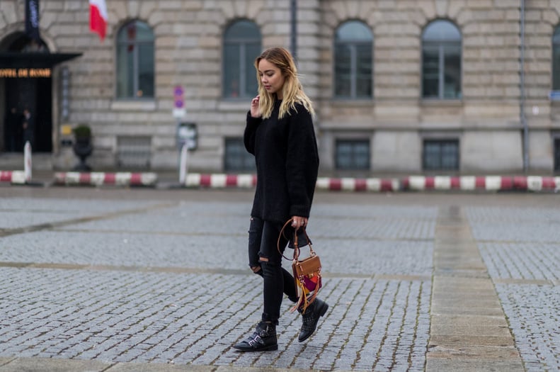 With buckled booties and distressed jeans for a rocker-chic vibe.