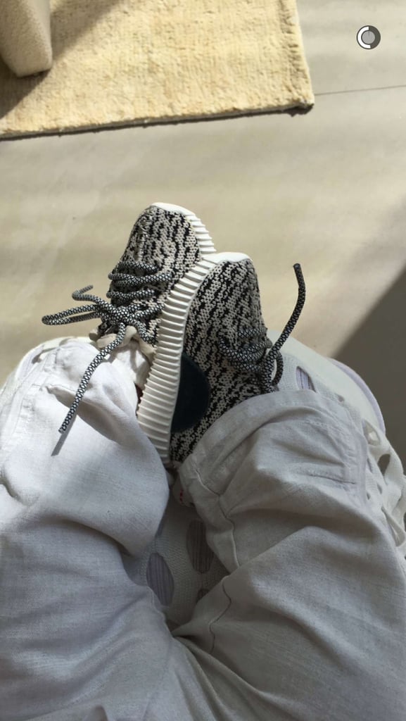 Meanwhile, Saint West showed off his baby Yeezys.