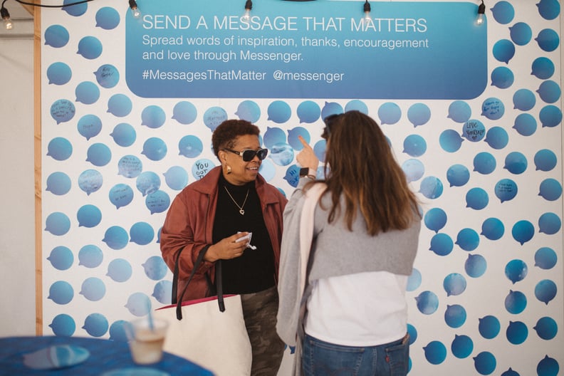 Two women discussed the wall at the event.