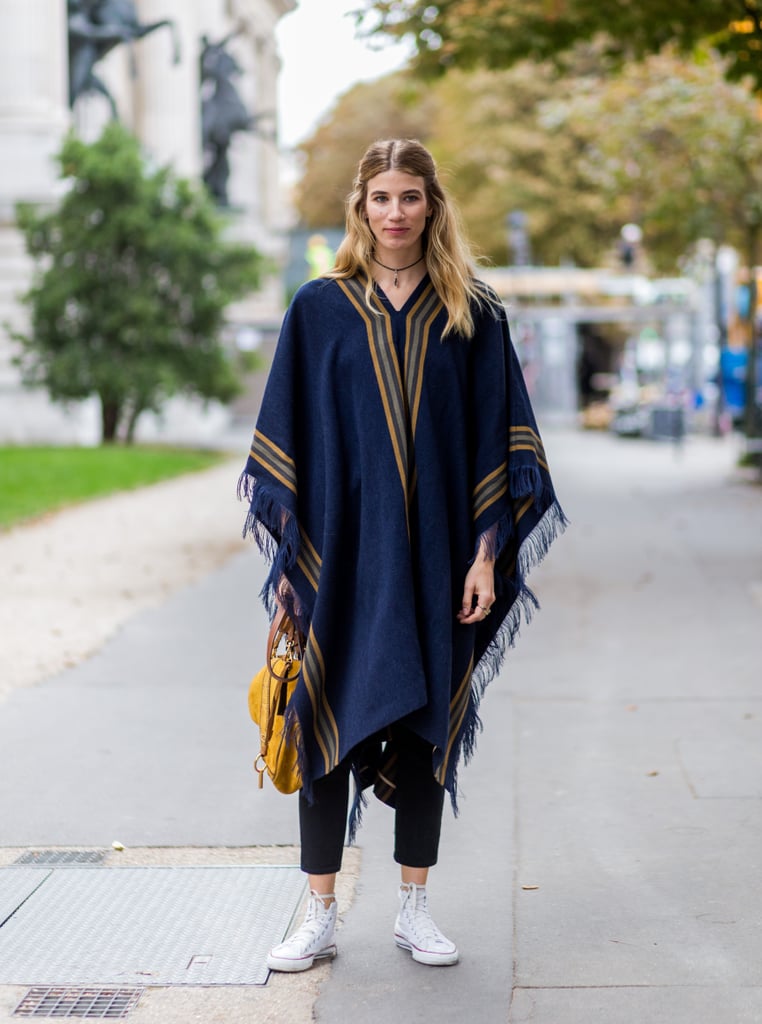 If you're going for a look that's sporty-meets-boho, style a fringed poncho over slim jeans and complete with your high tops and a pendant choker.