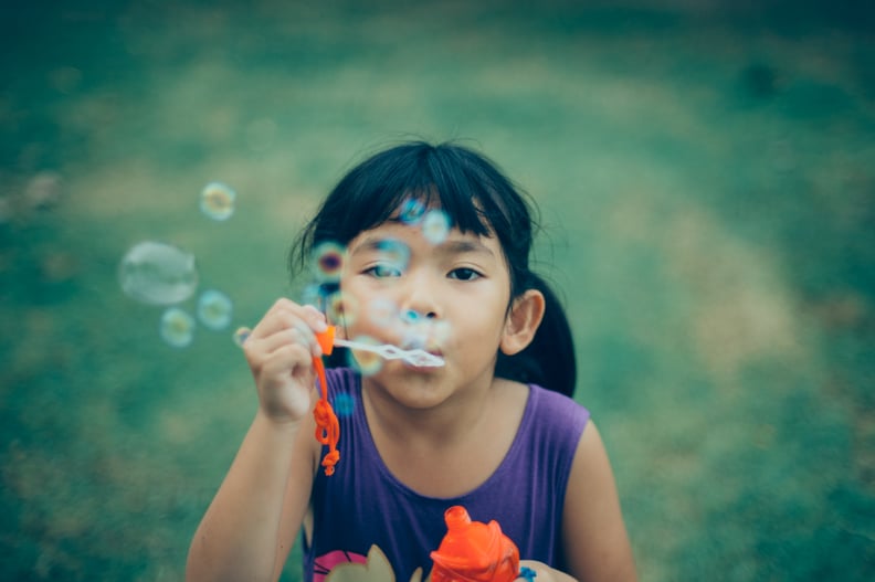 Blow bubbles.