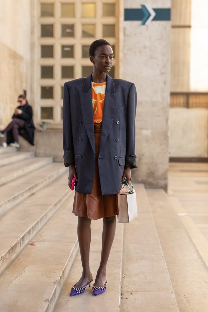 Style a bold-shouldered blazer with a knee-length skirt and kitten heels for a retro look.